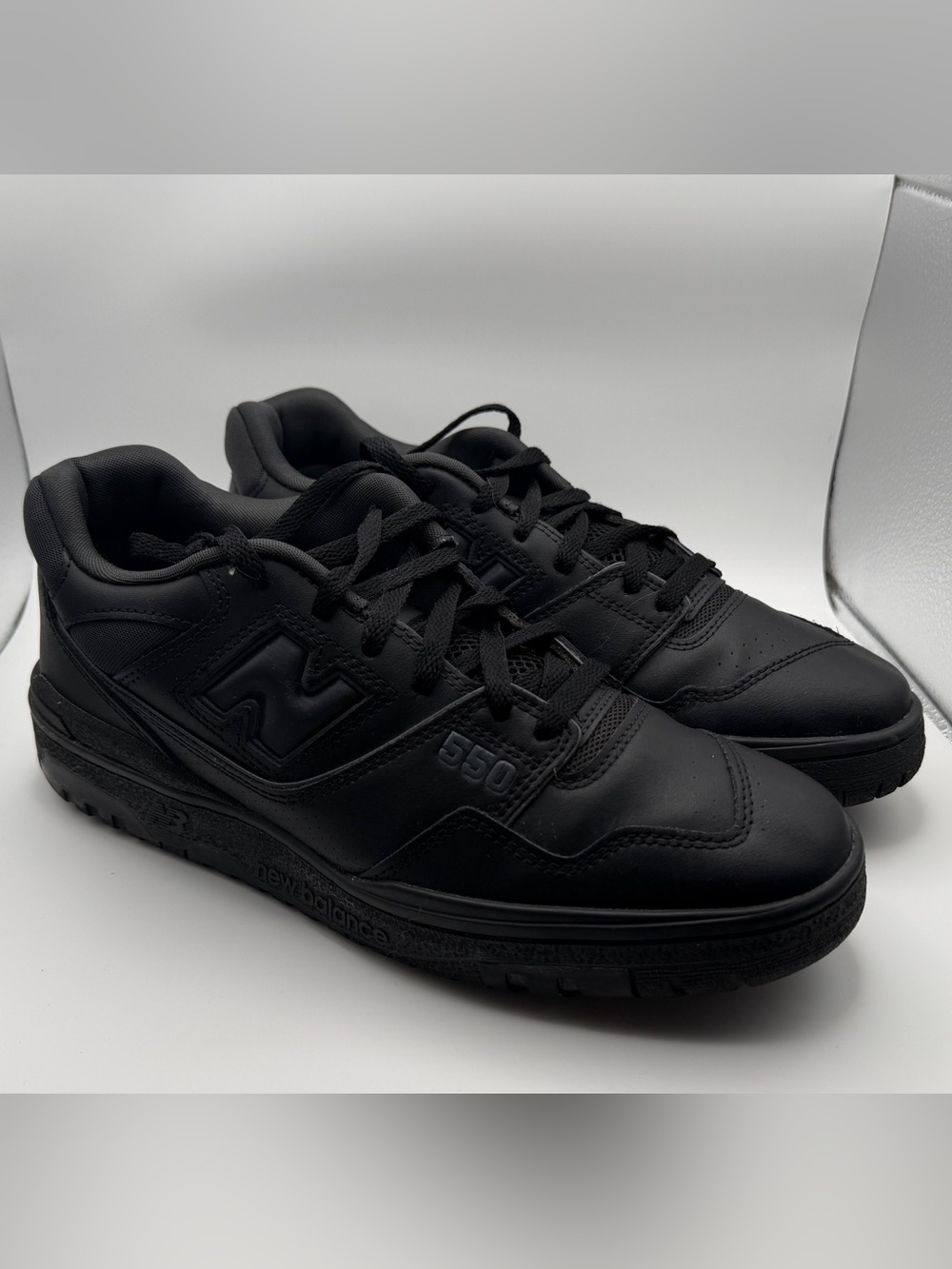 New Balance 550 Men's Triple Black Leather Low-Top Sneakers.
